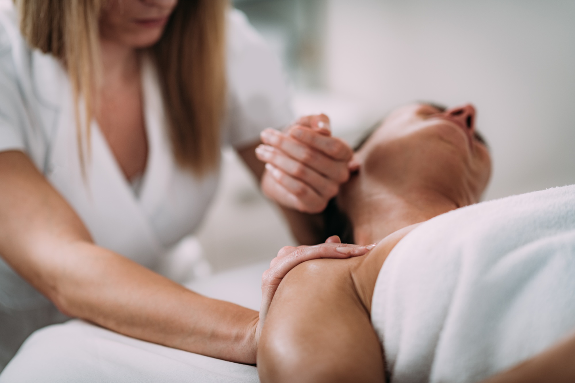 Client receiving integrative massage therapy at Sanctuary of Integration Wellness Center for holistic healing and relaxation