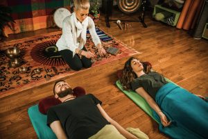 Vibroacoustic therapy session at Sanctuary of Integration Wellness Center using sound table and healing frequencies